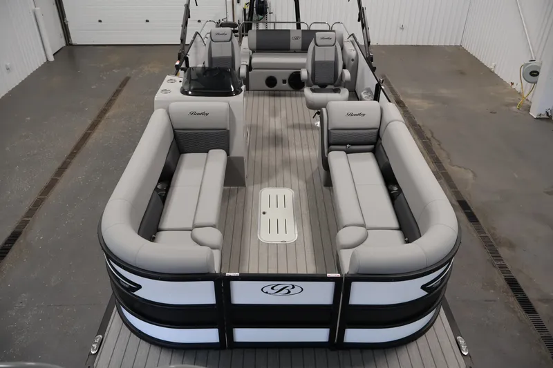 Slide: The Image of 2026 Bentley Pontoons 253 Swingback Dual Captain Elite Tri-Toon with luxurious seating and sleek design. - 8