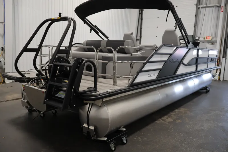 Slide: The Image of 2026 Bentley Pontoons 253 Swingback Dual Captain Elite Tri-Toon in a showroom setting. - 4