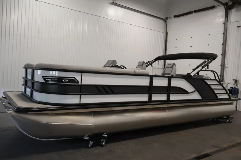 Slide: The Image of 2026 Bentley Pontoons 253 Swingback Dual Captain Elite Tri-Toon in a showroom setting. - 7