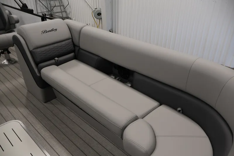 Slide: The Image of 2026 Bentley Pontoons 253 Swingback interior with luxurious gray seating and elegant design. - 11