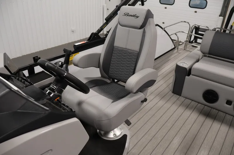 Slide: The Image of 2026 Bentley Pontoons 253 Swingback Dual Captain Elite Tri-Toon interior with captain's chair. - 30