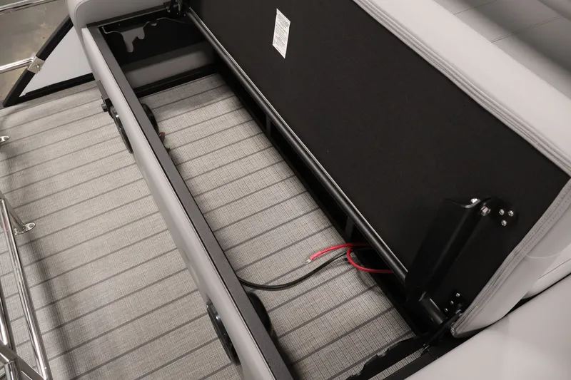 Slide: The Image of 2026 Bentley Pontoons 253 Swingback storage compartment with wiring, showcasing sleek design and functionality. - 35