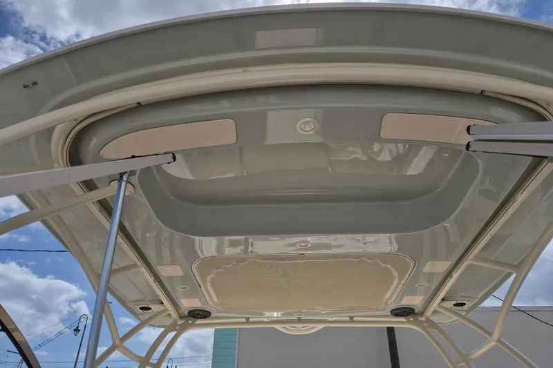 Slide: The Image of 2026 Grady-White Freedom 285 boat hardtop under a blue sky. - 19