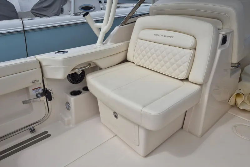 Slide: The Image of 2026 Grady-White Freedom 285 boat interior with luxurious seating and cup holders. - 21