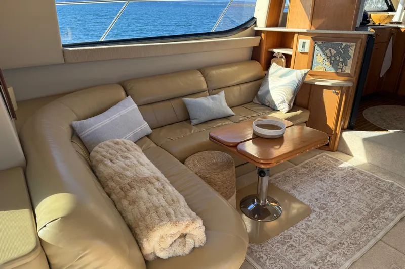Slide: The Image of Luxurious interior of 2004 Meridian 411 Sedan yacht with leather seating and ocean view. - 10