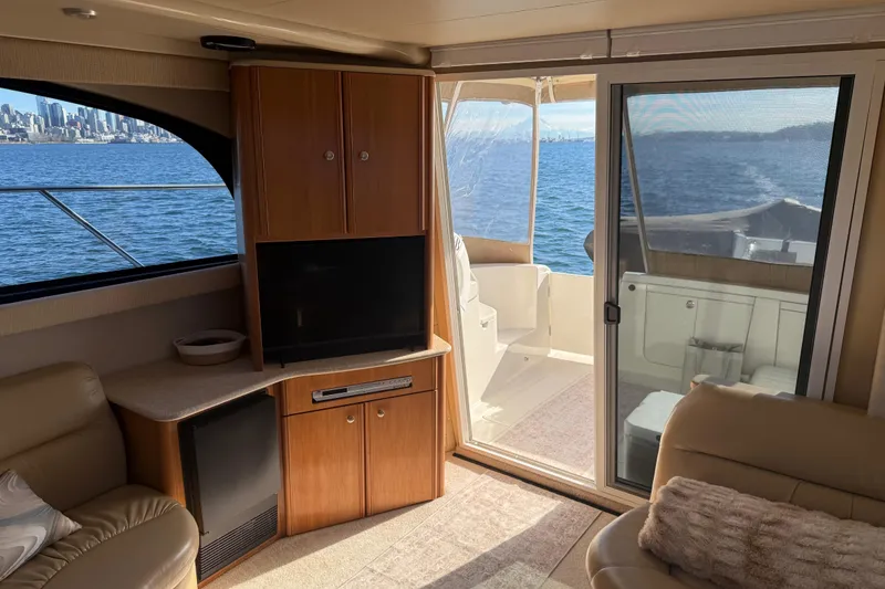 Slide: The Image of Interior of 2004 Meridian 411 Sedan yacht with city skyline view. - 15