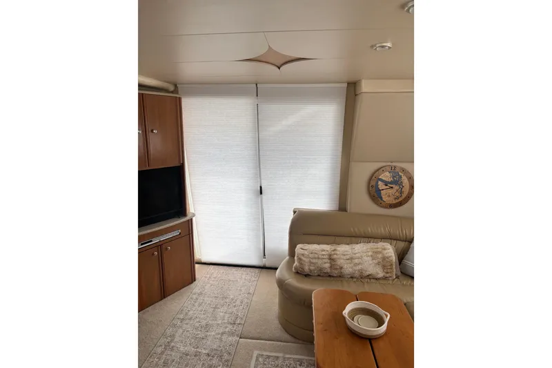 Slide: The Image of Interior of 2004 Meridian 411 Sedan yacht with cozy seating and decor. - 21