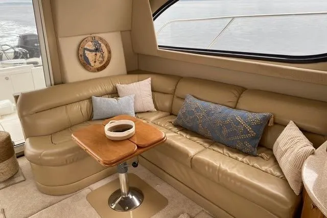 Slide: The Image of Luxurious interior of 2004 Meridian 411 Sedan yacht with leather seating and decorative pillows. - 22