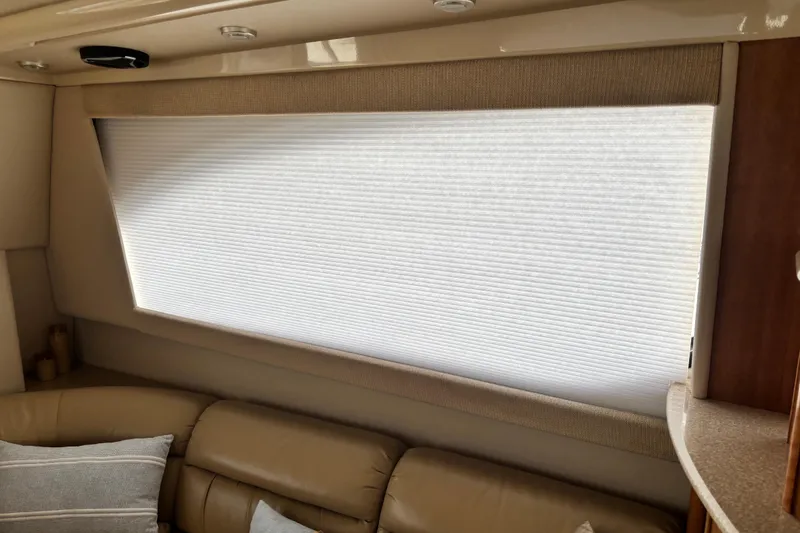 Slide: The Image of Interior of 2004 Meridian 411 Sedan with beige leather seating and window blinds. - 23
