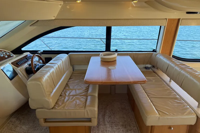 Slide: The Image of Interior of 2004 Meridian 411 Sedan yacht with leather seating and ocean view. - 26