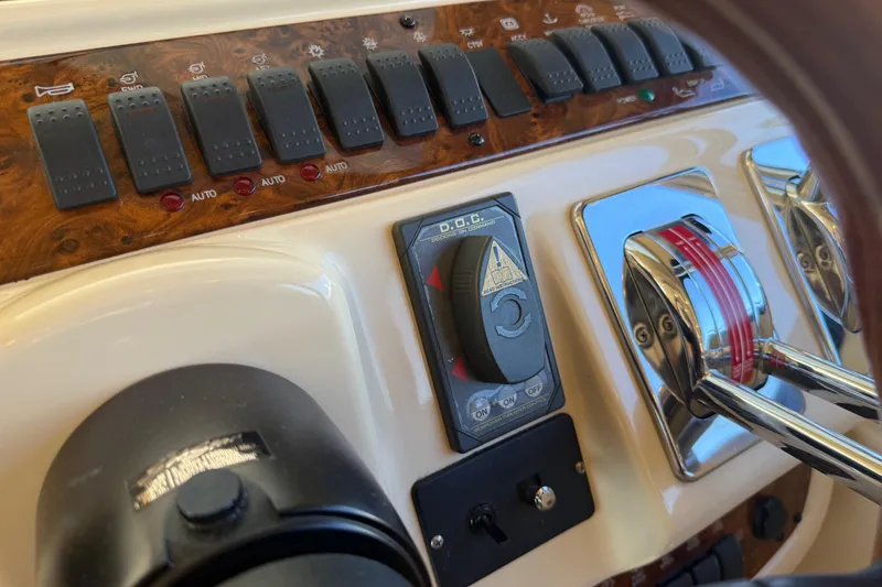 Slide: The Image of Close-up of 2004 Meridian 411 Sedan dashboard controls and switches. - 31