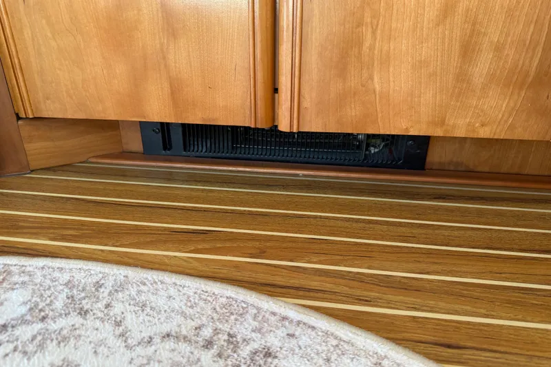 Slide: The Image of Wooden interior of 2004 Meridian 411 Sedan with striped flooring and cabinetry. - 36