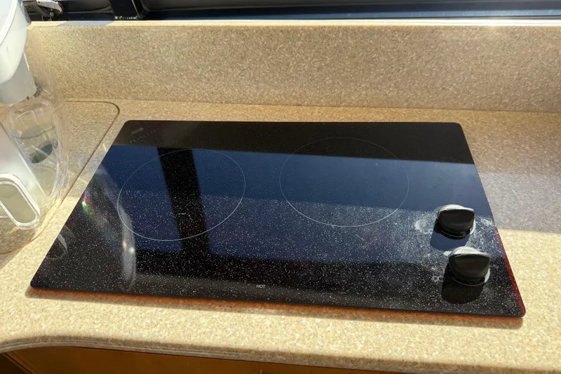 Slide: The Image of Ceramic cooktop on 2004 Meridian 411 Sedan yacht kitchen counter. - 40