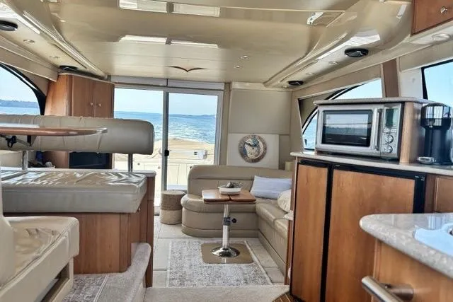 Slide: The Image of Luxurious interior of a 2004 Meridian 411 Sedan yacht with ocean view. - 41