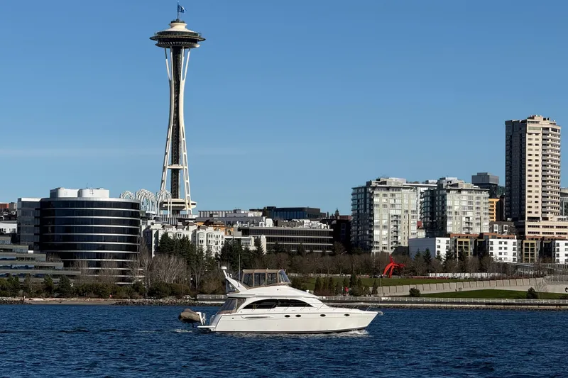 Slide: The Image of 2004 Meridian 411 Sedan yacht on Seattle waters with Space Needle in background. - 5