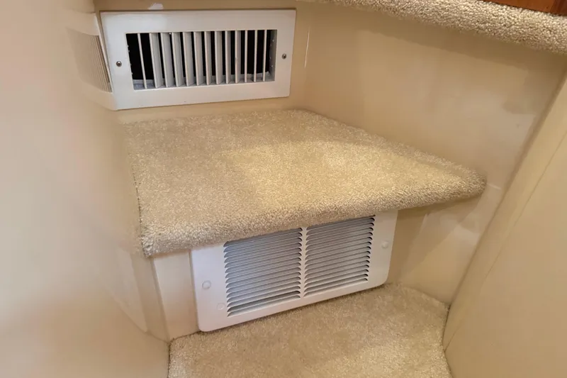 Slide: The Image of Carpeted interior step with vents in a 2004 Meridian 411 Sedan. - 50