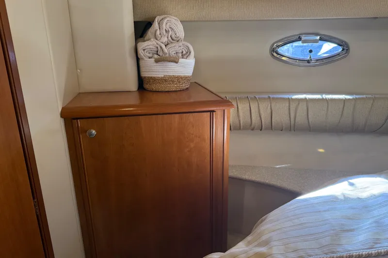 Slide: The Image of Interior of 2004 Meridian 411 Sedan with wooden cabinet and porthole window. - 51