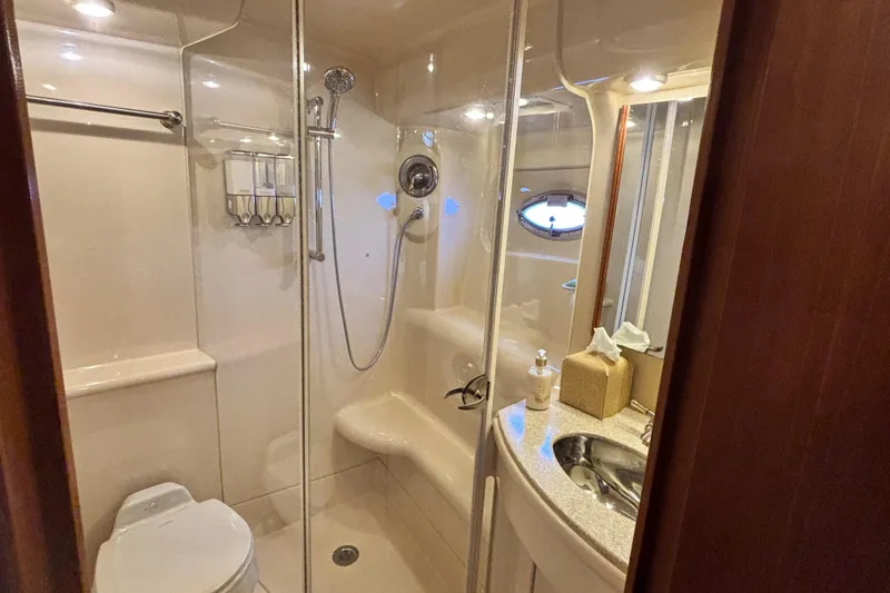 Slide: The Image of Luxurious bathroom in 2004 Meridian 411 Sedan yacht with shower and sink. - 53