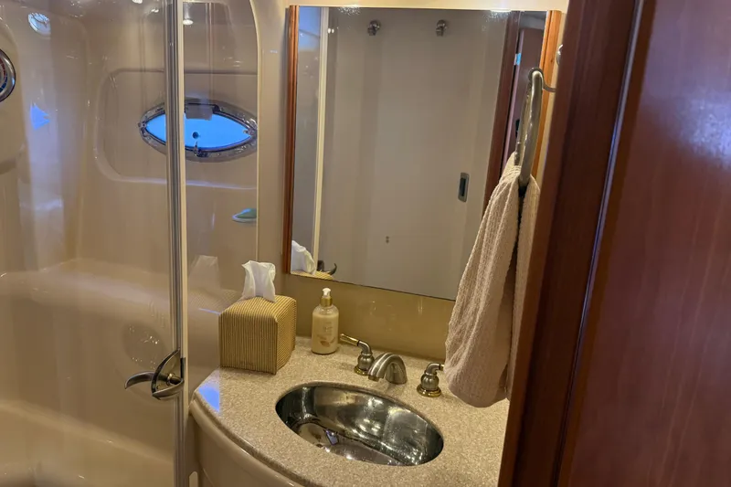 Slide: The Image of Bathroom interior of 2004 Meridian 411 Sedan yacht with sink and mirror. - 54