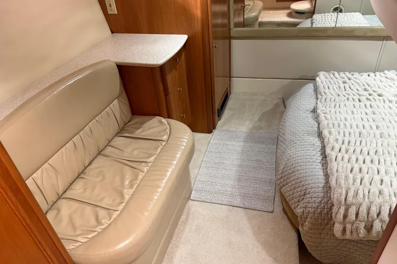 Slide: The Image of Interior of 2004 Meridian 411 Sedan with beige seating and cozy bed. - 60