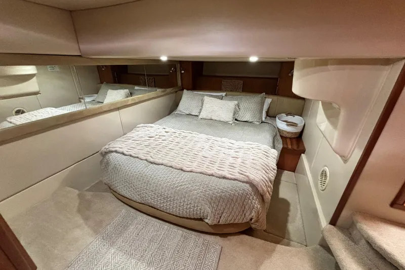 Slide: The Image of Luxurious bedroom interior of 2004 Meridian 411 Sedan yacht with cozy bedding. - 61