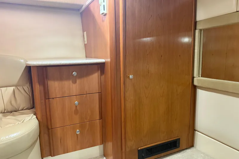 Slide: The Image of Interior of 2004 Meridian 411 Sedan with wooden cabinetry and beige seating. - 63