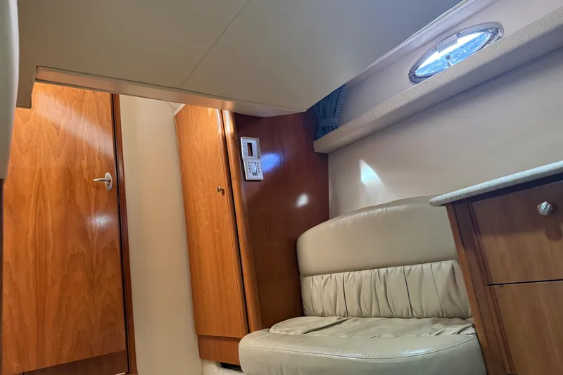 Slide: The Image of Interior of 2004 Meridian 411 Sedan yacht with wood paneling and leather seating. - 67