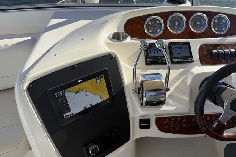 Slide: The Image of 2004 Meridian 411 Sedan dashboard with navigation and control instruments. - 79