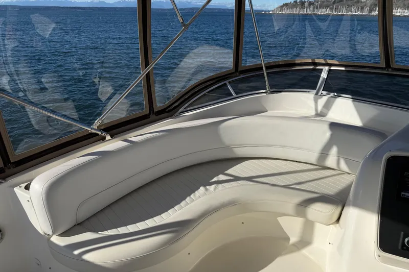 Slide: The Image of Luxurious seating area on a 2004 Meridian 411 Sedan yacht with ocean view. - 84