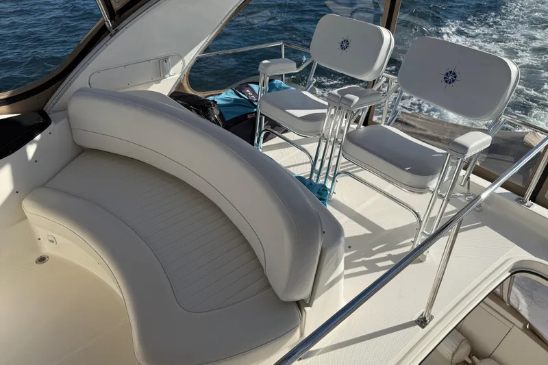 Slide: The Image of Luxurious seating on a 2004 Meridian 411 Sedan yacht, overlooking the ocean. - 86