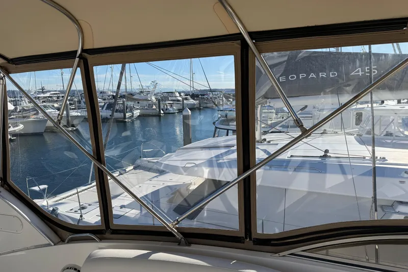 Slide: The Image of View from a 2004 Meridian 411 Sedan yacht overlooking a marina with boats. - 88