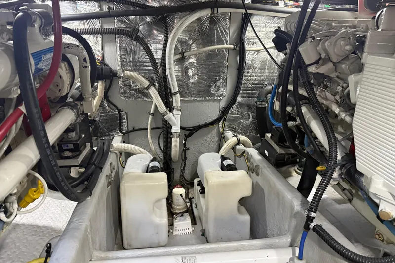 Slide: The Image of Engine room of a 2004 Meridian 411 Sedan, showcasing mechanical components and wiring. - 93