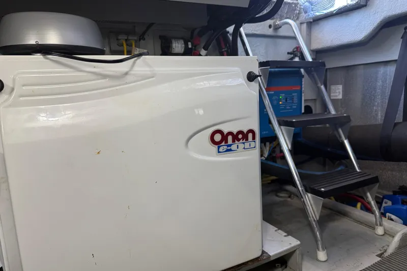 Slide: The Image of Engine room of 2004 Meridian 411 Sedan with Onan generator and ladder. - 96