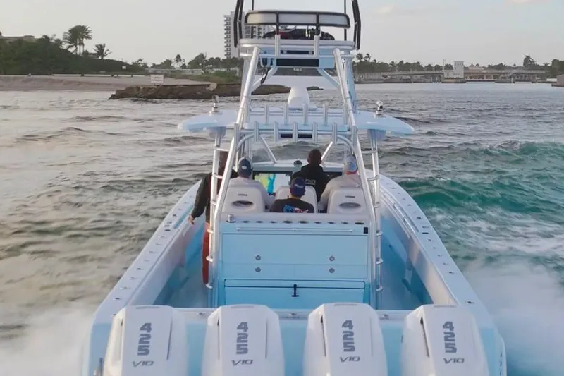 The Image of 2026 Contender 44 ST boat cruising swiftly on open water. - 0