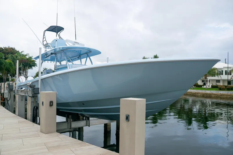 Slide: The Image of Contender 44 ST 2026 boat docked, sleek modern design. - 10