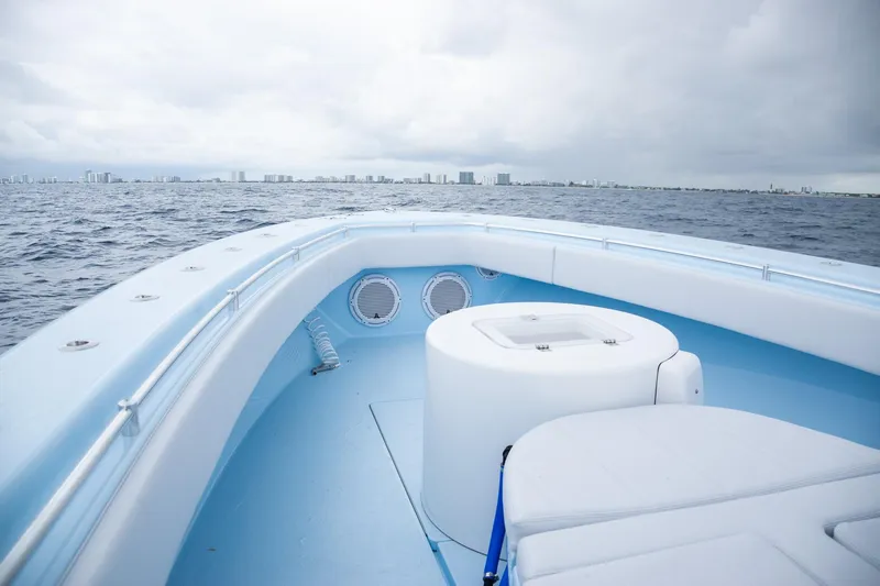 Slide: The Image of Contender 44 ST 2026 on open sea with city skyline in background. - 13