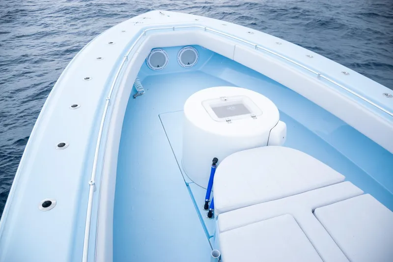 Slide: The Image of Contender 44 ST 2026 boat, bow deck view on the ocean. - 14