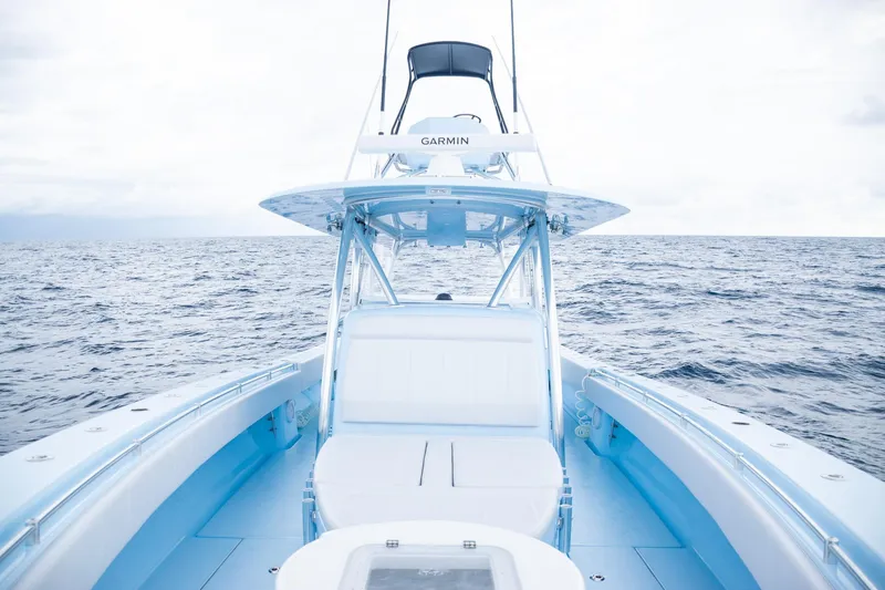 Slide: The Image of 2026 Contender 44 ST boat on open ocean, featuring sleek design and advanced navigation. - 19