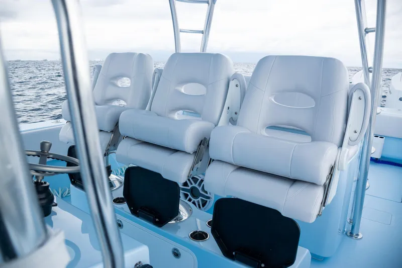 Slide: The Image of 2026 Contender 44 ST boat with luxurious white seating on open water. - 25