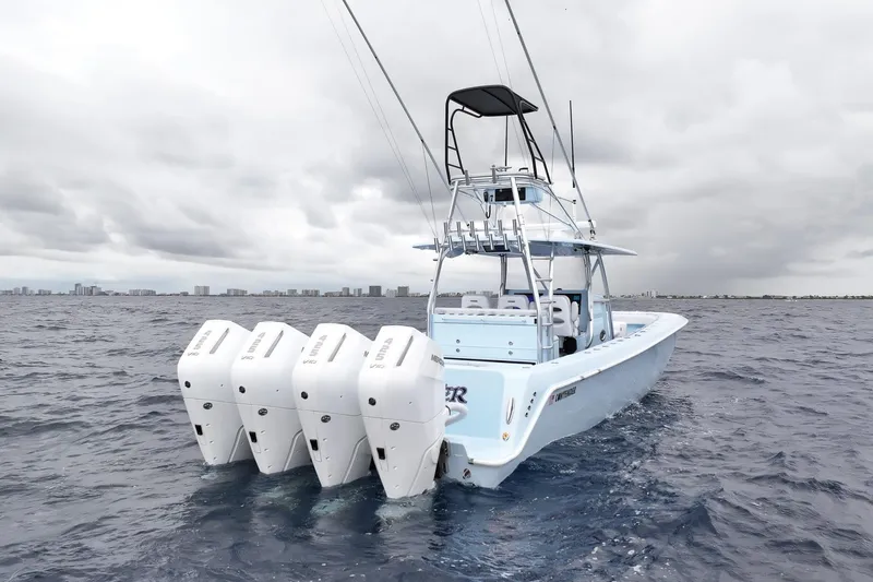 Slide: The Image of 2026 Contender 44 ST boat on open ocean, featuring multiple outboard engines. - 3