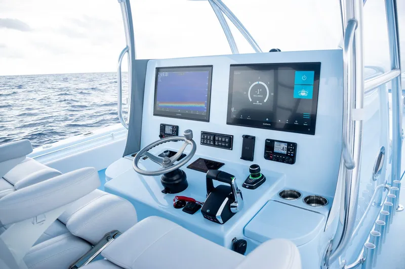 Slide: The Image of Interior view of 2026 Contender 44 ST boat cockpit with modern electronics. - 41