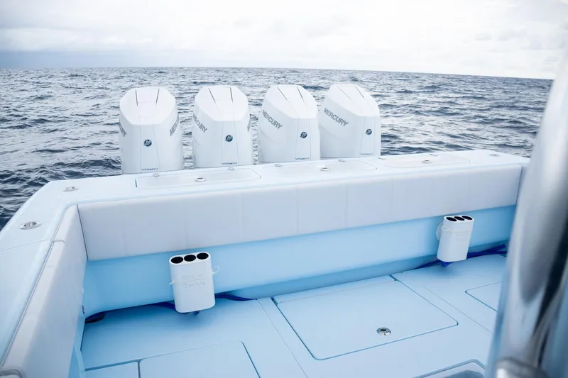 Slide: The Image of Contender 44 ST 2026 boat with five Mercury engines on open sea. - 48