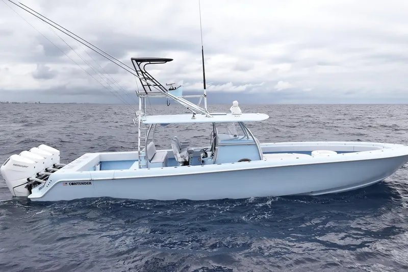 Slide: The Image of 2026 Contender 44 ST boat with four powerful outboard engines on open water. - 5