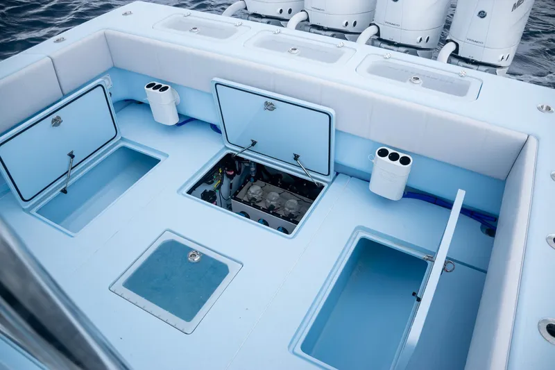 Slide: The Image of Contender 44 ST 2026 boat with open storage and engine compartment. - 52