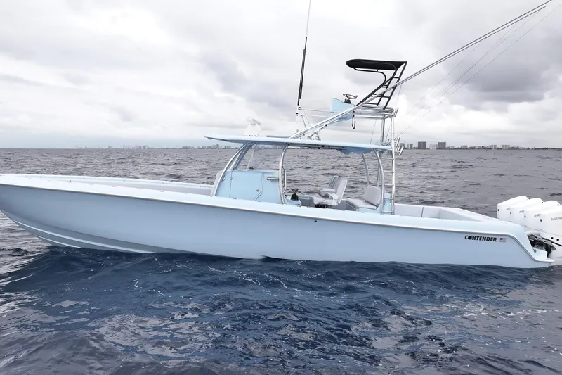 Slide: The Image of 2026 Contender 44 ST boat with quad engines on open ocean. - 6