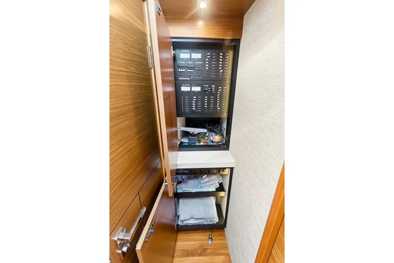 Slide: The Image of Electrical panel and storage inside 2017 Tiara Yachts C39 Coupe. - 13