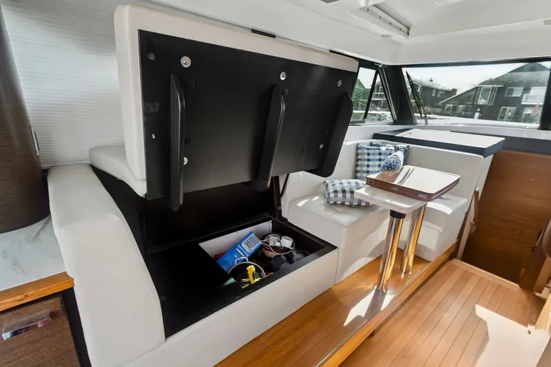 Slide: The Image of Interior of 2017 Tiara Yachts C39 Coupe with storage and seating area. - 17