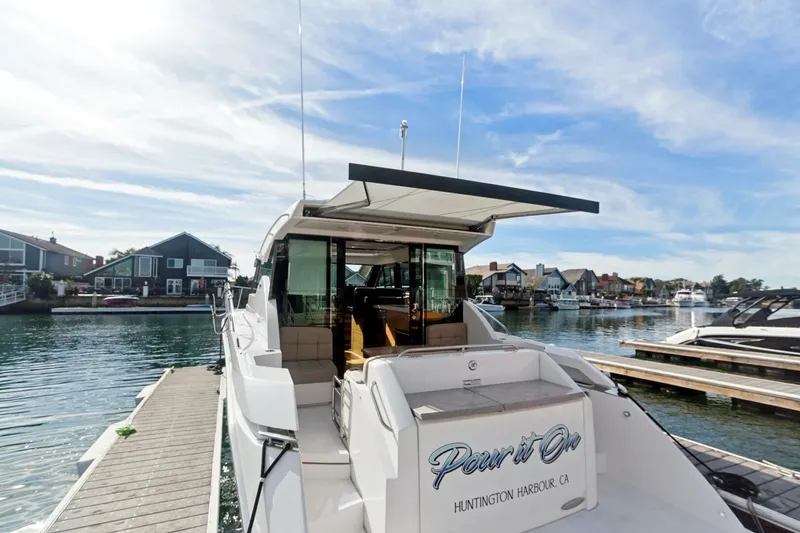 Slide: The Image of 2017 Tiara Yachts C39 Coupe docked at Huntington Harbour, CA, under a clear sky. - 22