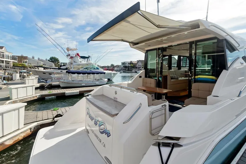 Slide: The Image of 2017 Tiara Yachts C39 Coupe docked at marina, showcasing luxurious interior and exterior design. - 24