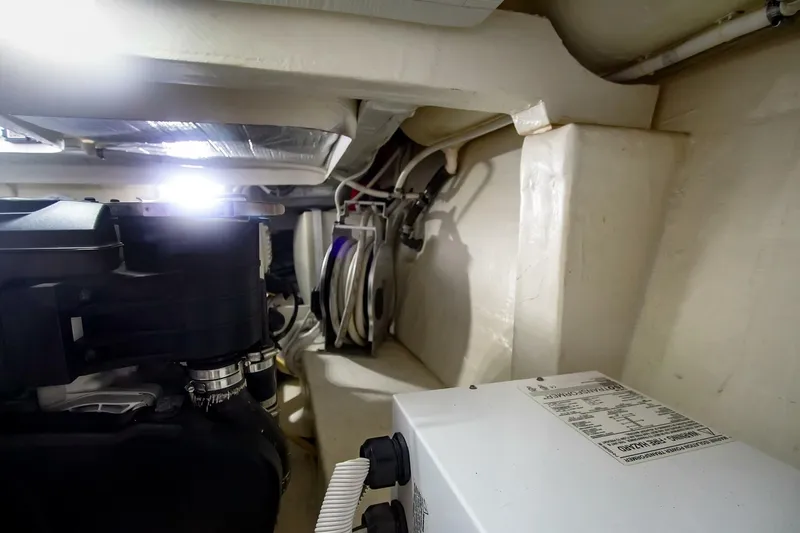 Slide: The Image of Engine room of 2017 Tiara Yachts C39 Coupe, showcasing mechanical components. - 32